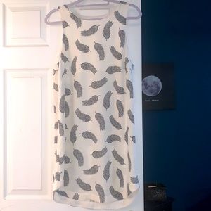 White dress with black feather design